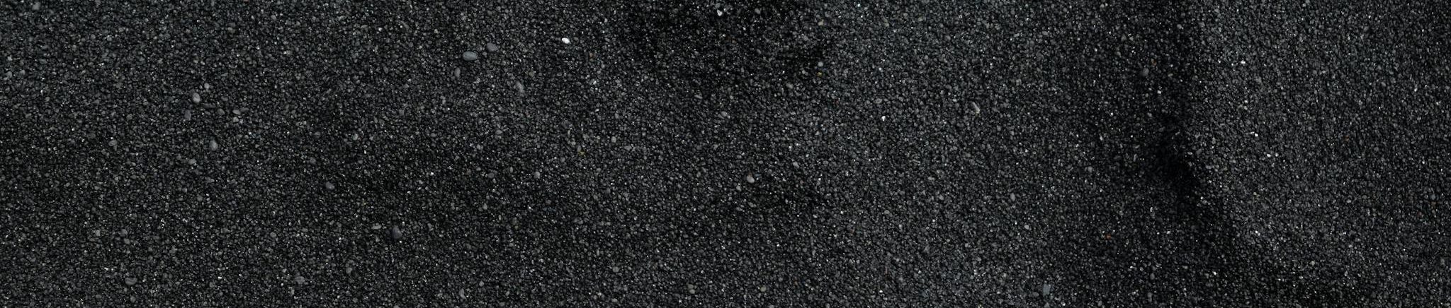 Close Up Photo of Black Sand